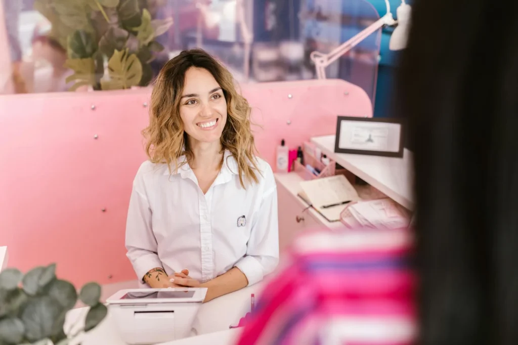 Salon owner managing multiple location bookings on WordPress dashboard with calendar and appointment schedule